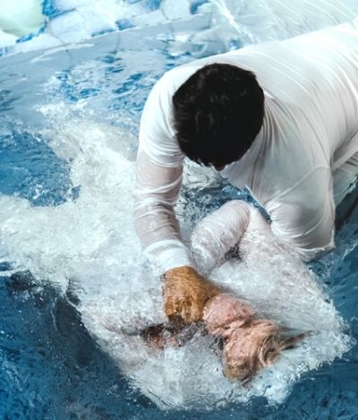 pastor-baptize-a-man-in-the-name-of-christ.jpg
