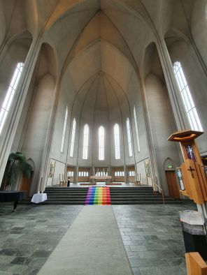 Chuch white inside with rainbow runner on the steps