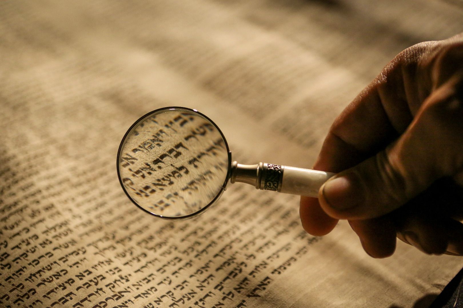 Hebrew writting under Magnifying glass